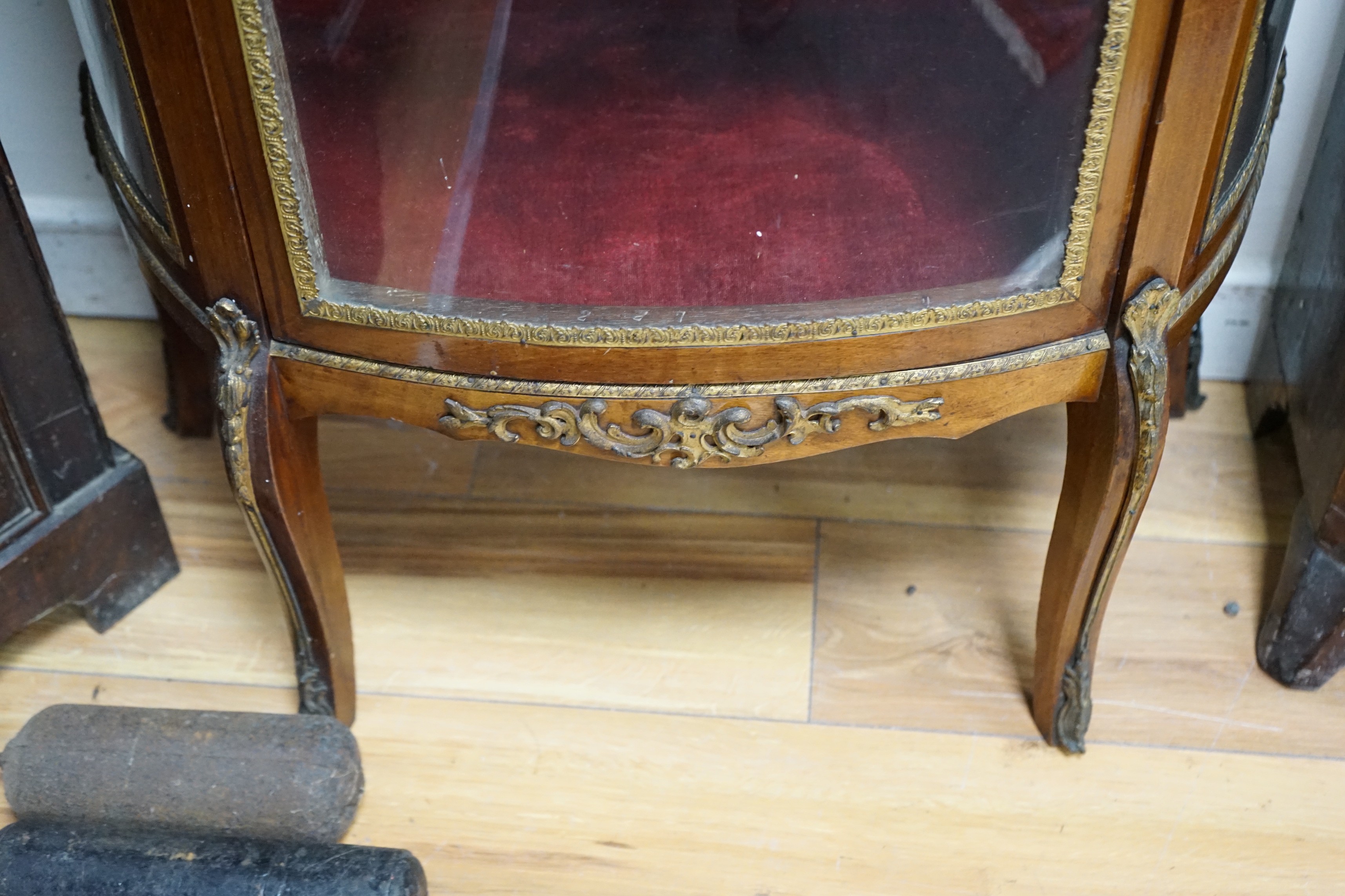 An early 20th century French gilt metal mounted mahogany vitrine, width 66cm, depth 32cm, height 138cm